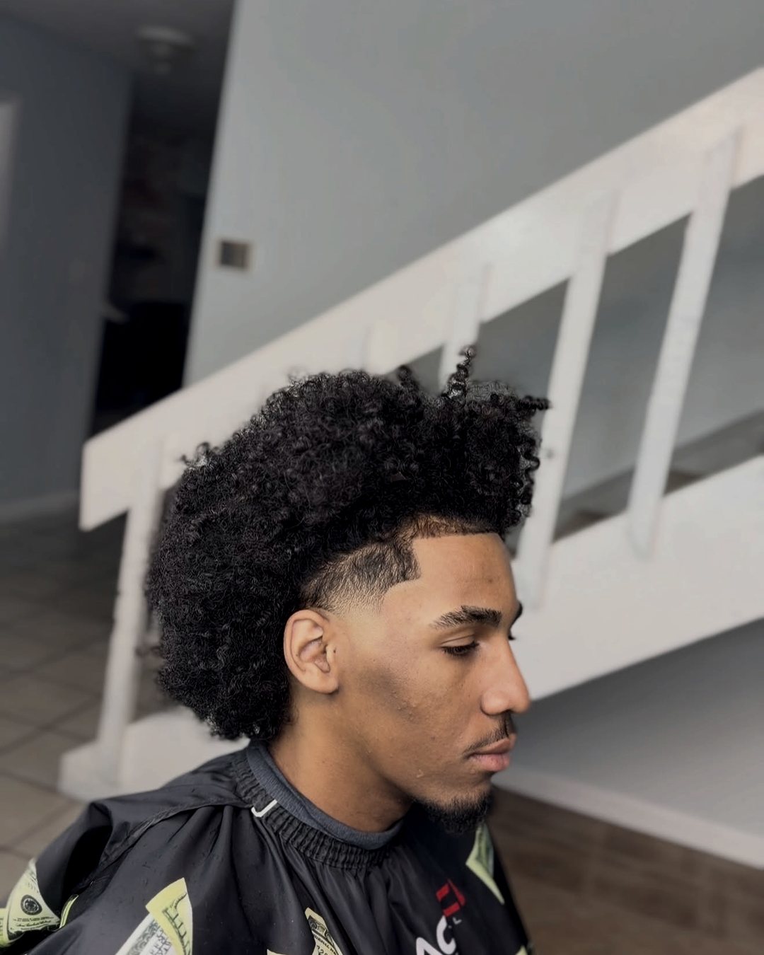 Curly high top with a clean taper