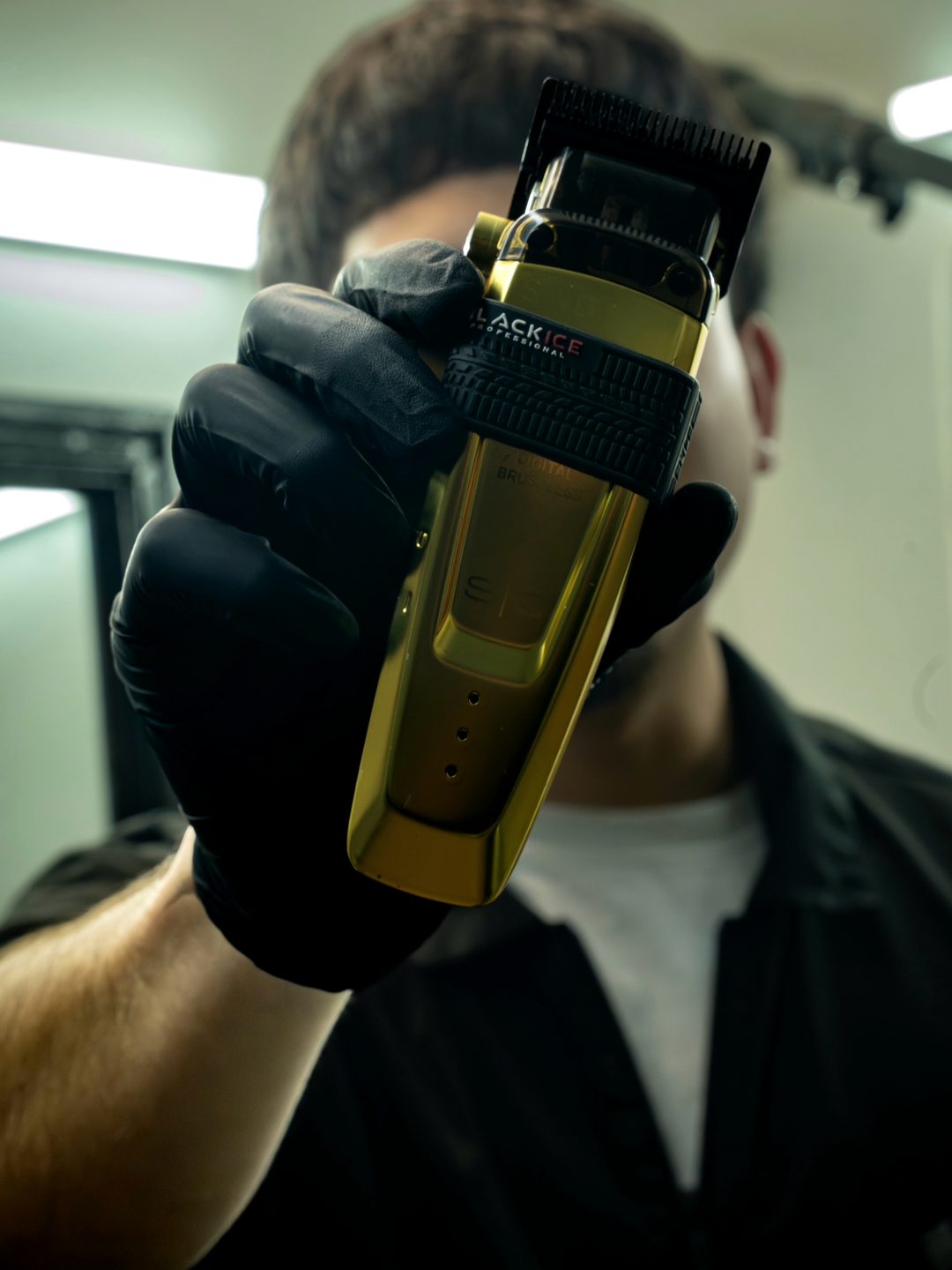 Diego holding his gold Black Ice clipper toward the camera
